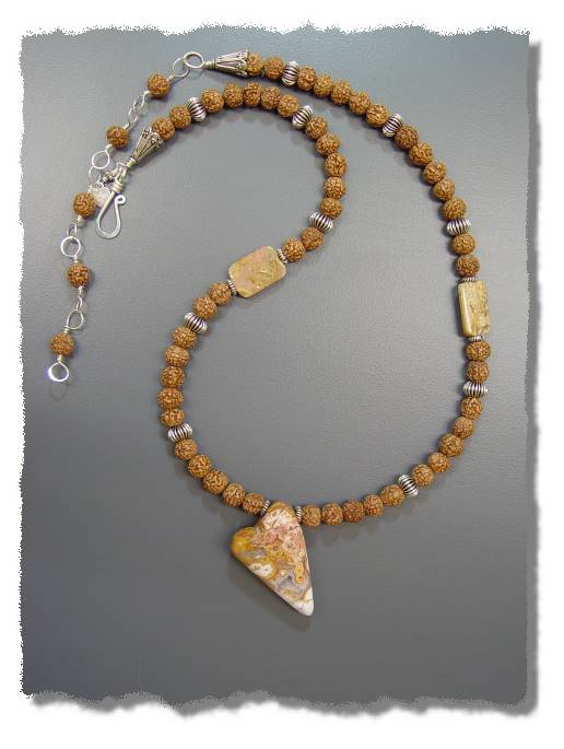 Crystals of Wisdom Nestle in an Open Heart Necklace